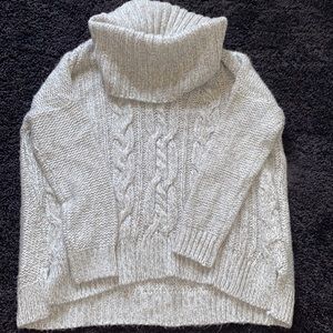 Jennifer Lopez large turtle neck sweater